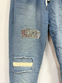 Italian jogger pants - Distressed denim with sequin patch